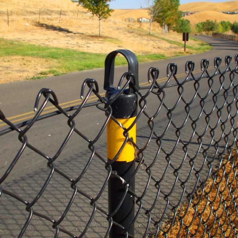 a chain link fence on roadside